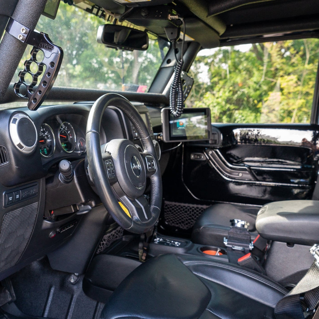 CMM Offroad UTV cockpit with cage-mounted grab handle — available from Offroad Trading Company