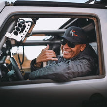 Load image into Gallery viewer, CMM Offroad driver holding knuckle grab handle inside Jeep — available from Offroad Trading Company