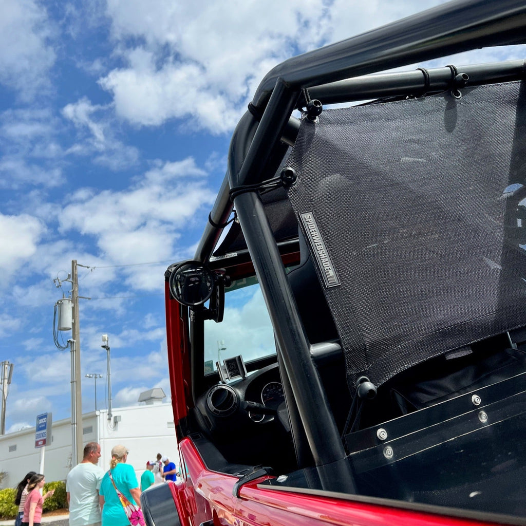 CMM Offroad inverted handle beside aftermarket cage pillar — available from Offroad Trading Company