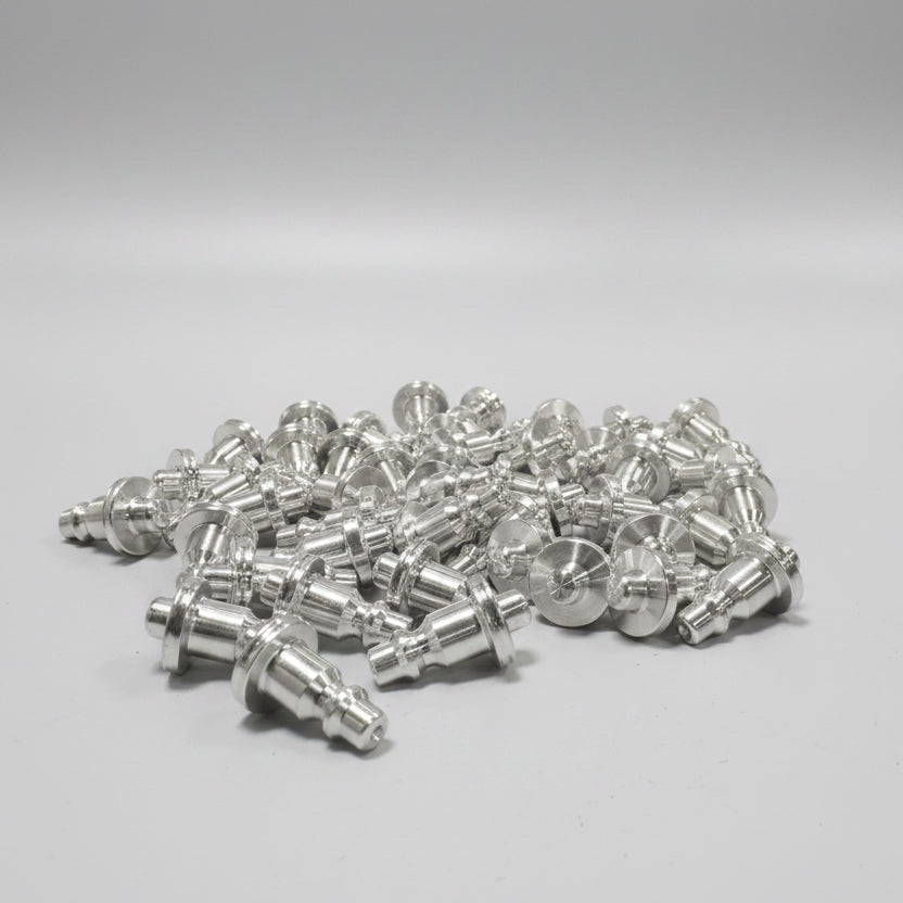 CMM Offroad machined metal pieces arranged on workbench — available from Offroad Trading Company