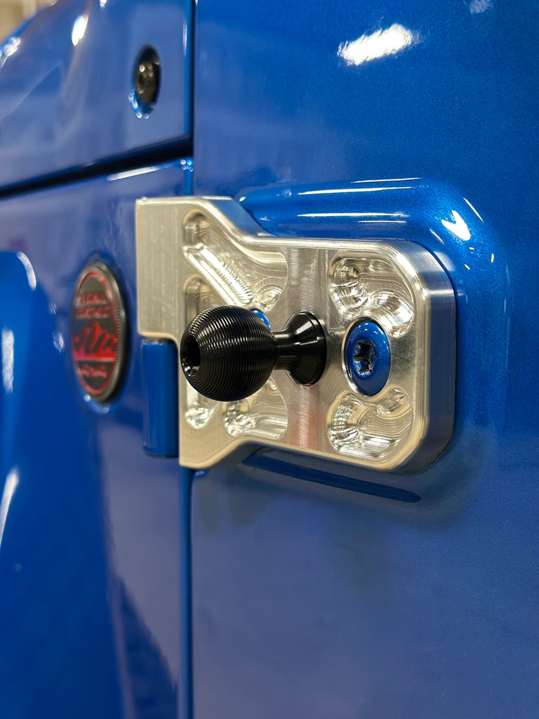 CMM Offroad hinge and ball mount on blue Jeep — available from Offroad Trading Company