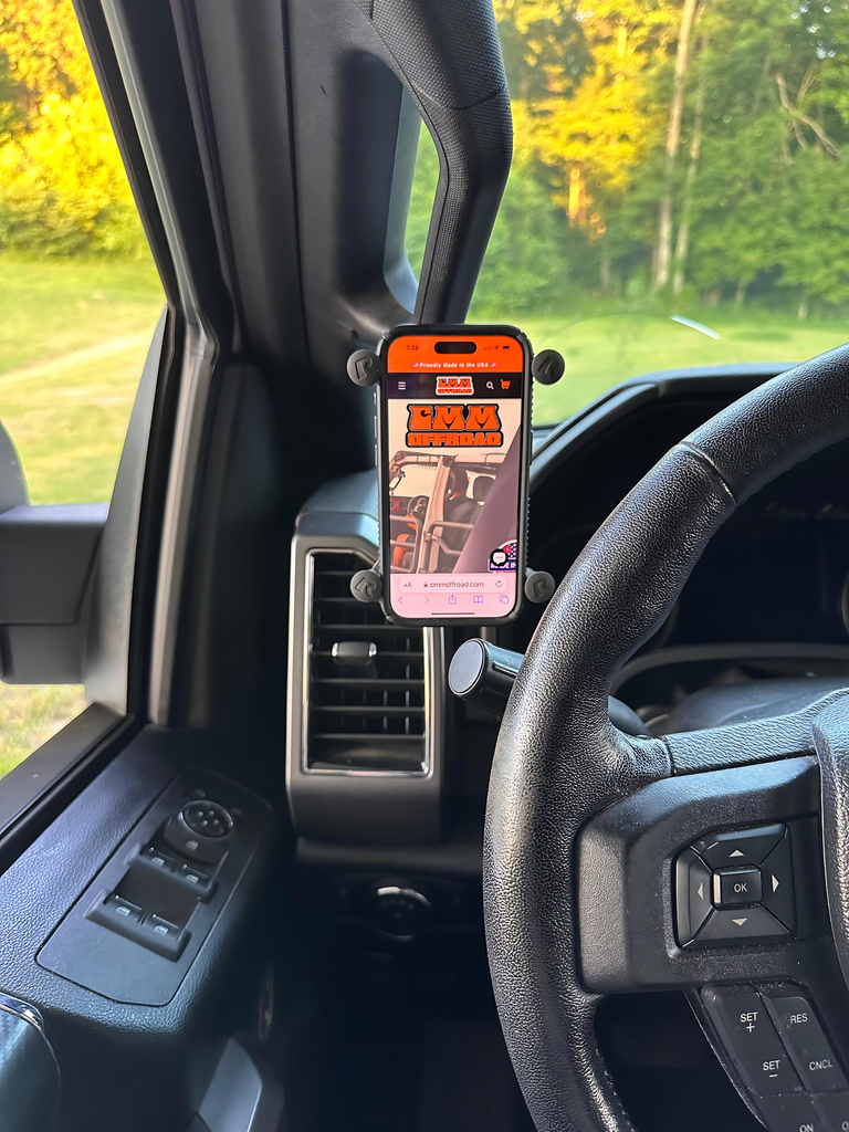 CMM Offroad phone mounted beside driver A-Pillar — available from Offroad Trading Company