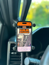 Load image into Gallery viewer, CMM Offroad phone displayed beside A-Pillar grab handle — available from Offroad Trading Company