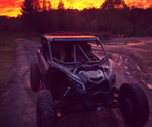 Load image into Gallery viewer, CMM Offroad UTV facing sunset on trail — available from Offroad Trading Company