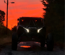Load image into Gallery viewer, CMM Offroad UTV at dusk with lights on — available from Offroad Trading Company
