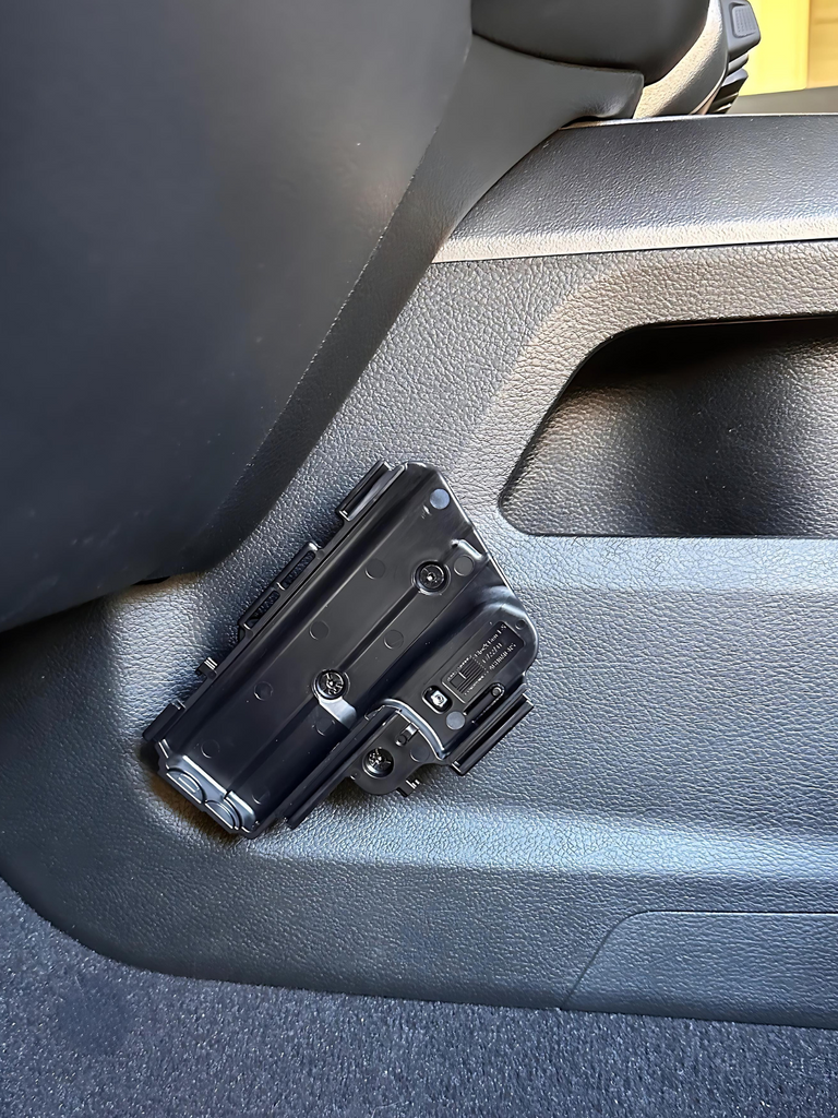 CMM Offroad accessory mounting bracket beside truck console — available from Offroad Trading Company