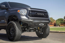Load image into Gallery viewer, Addictive Desert Designs Bumpers - Steel Addictive Desert Designs 2014+ Toyota Tundra Stealth Fighter Front Bumper w/Winch Mount &amp; Sensors