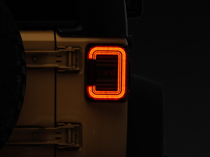 Raxiom Tail Lights Raxiom 07-18 Jeep Wrangler JK Axial Series LED Halo Tail Lights- Black Housing (Dark Smoked Lens)