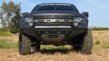 Load image into Gallery viewer, Addictive Desert Designs Bumpers - Steel Addictive Desert Designs 10-14 Ford F-150 Raptor HoneyBadger Front Bumper w/ Winch Mount