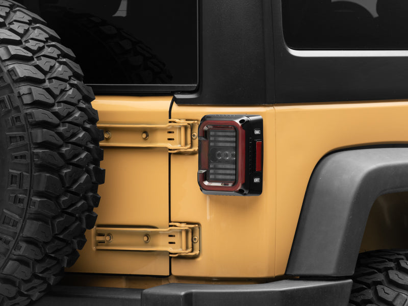 Raxiom Tail Lights Raxiom 07-18 Jeep Wrangler JK Axial Series LED Halo Tail Lights- Black Housing (Dark Smoked Lens)